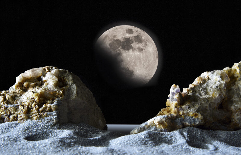 Altri mondi – fantasy lunar landscape with rocks and moon in the sky